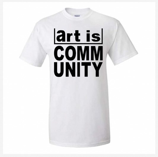 White t-shirt with 'art is COMMUNITY' text on a white background